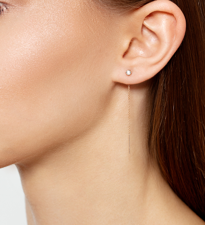 Золотые серьги «Линии света» с бриллиантом