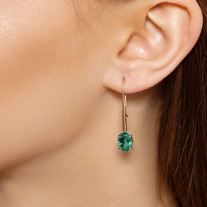 Золотые серьги с изумрудом